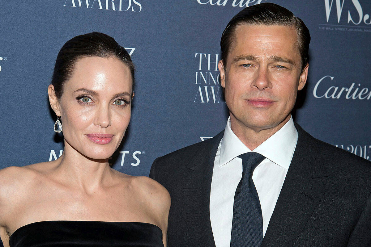 Angelina Jolie Pitt and Brad Pitt pose for a photo at the WSJ Magazine Innovator Awards 2015 at ...