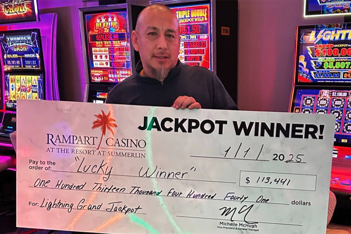 William V. of California celebrates his $113,411 Grand Jackpot win on the Lightning Link slot m ...