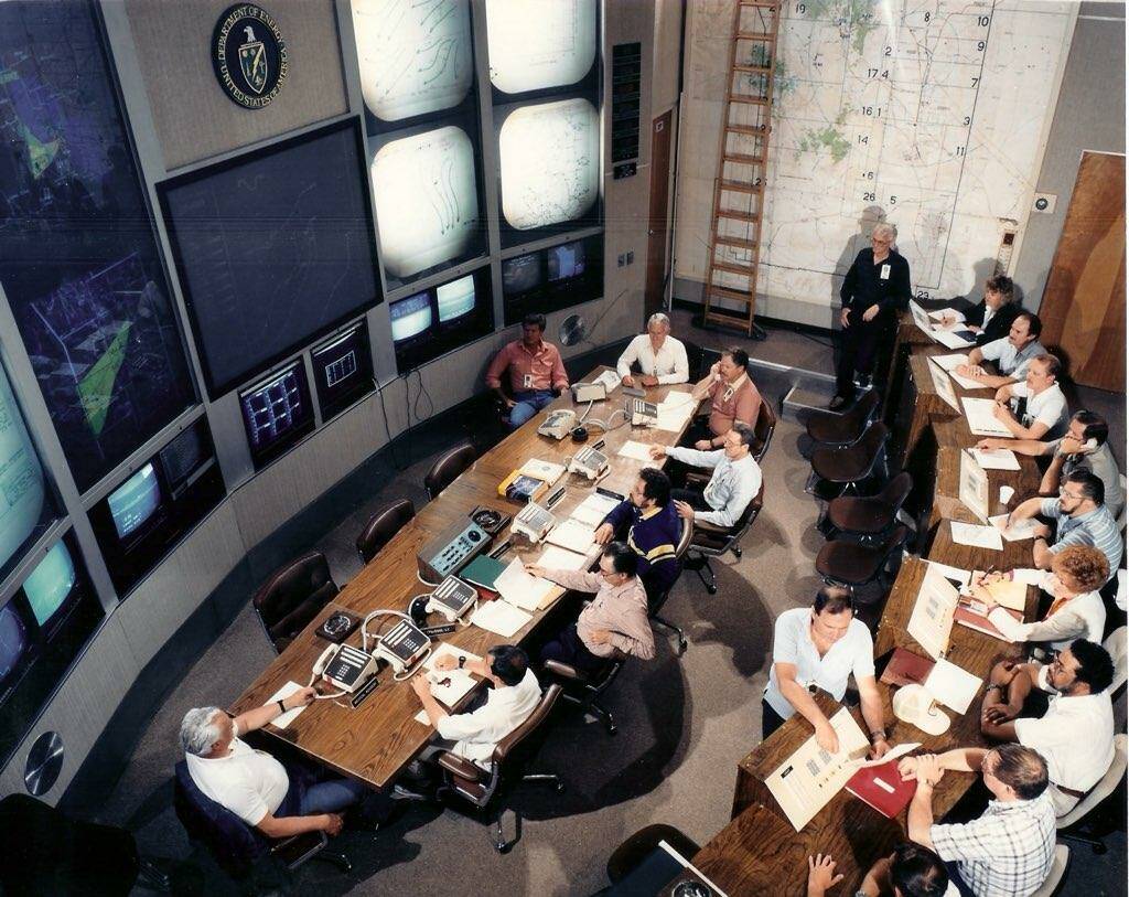 John D. Stewart, pictured on the left side of a control room table, died in St. George, Utah on ...