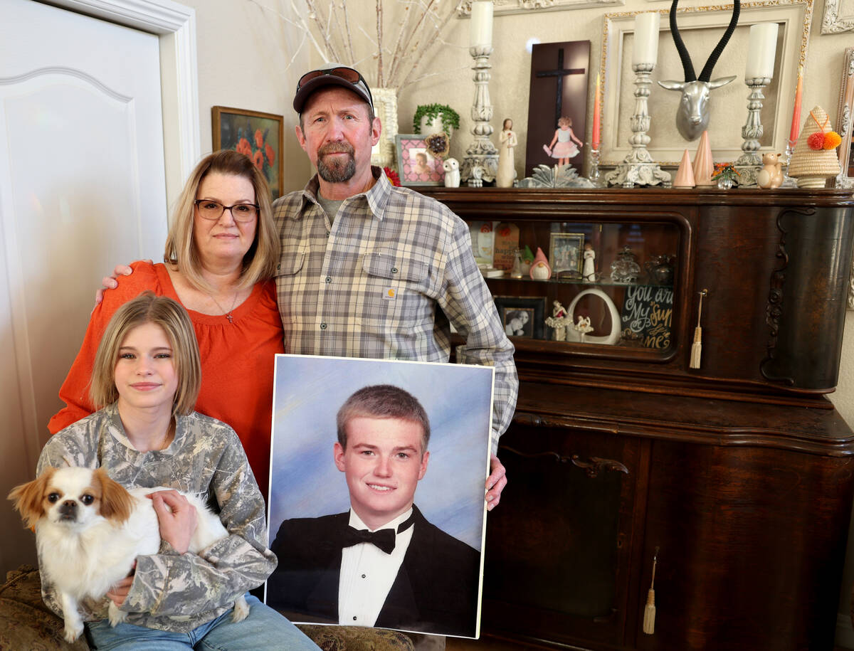 The family of Chris Ruby, who died while snowboarding, pose with his picture at their Las Vegas ...