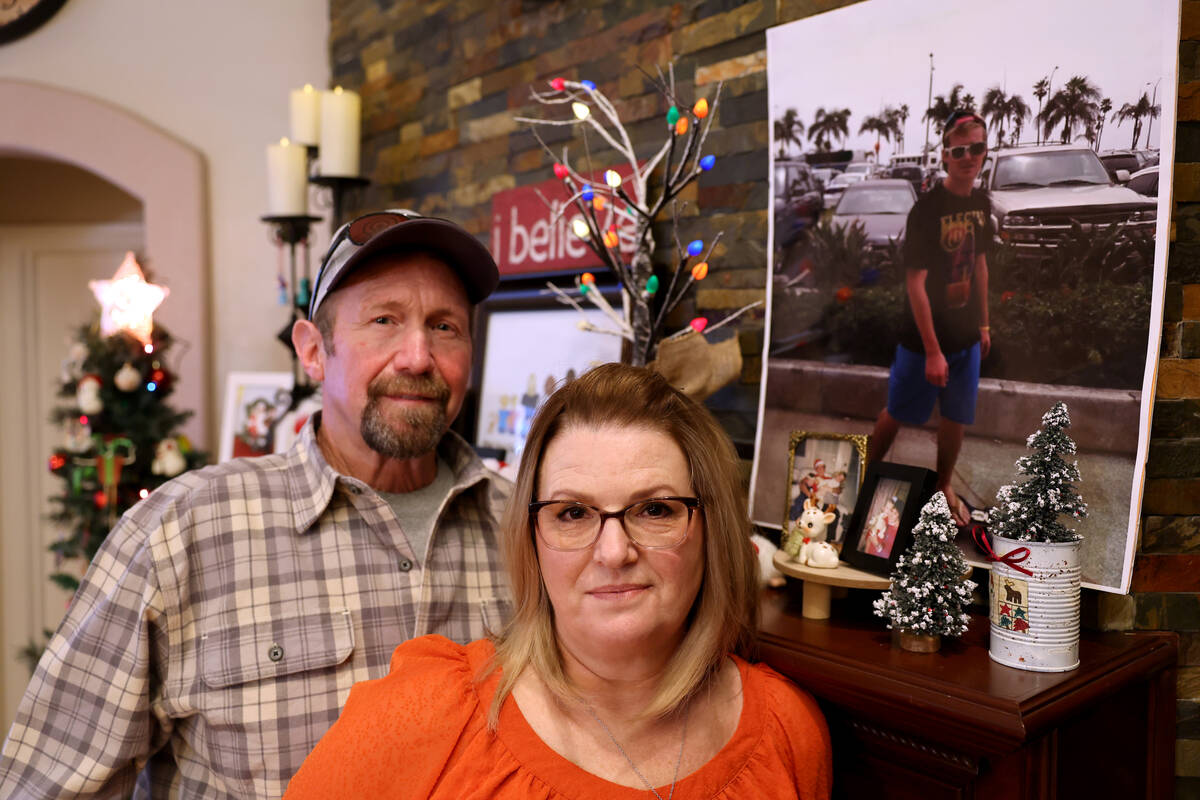 The parents Chris Ruby, Jeff and Sherry Ruby, pose with his picture at their Las Vegas home Tue ...