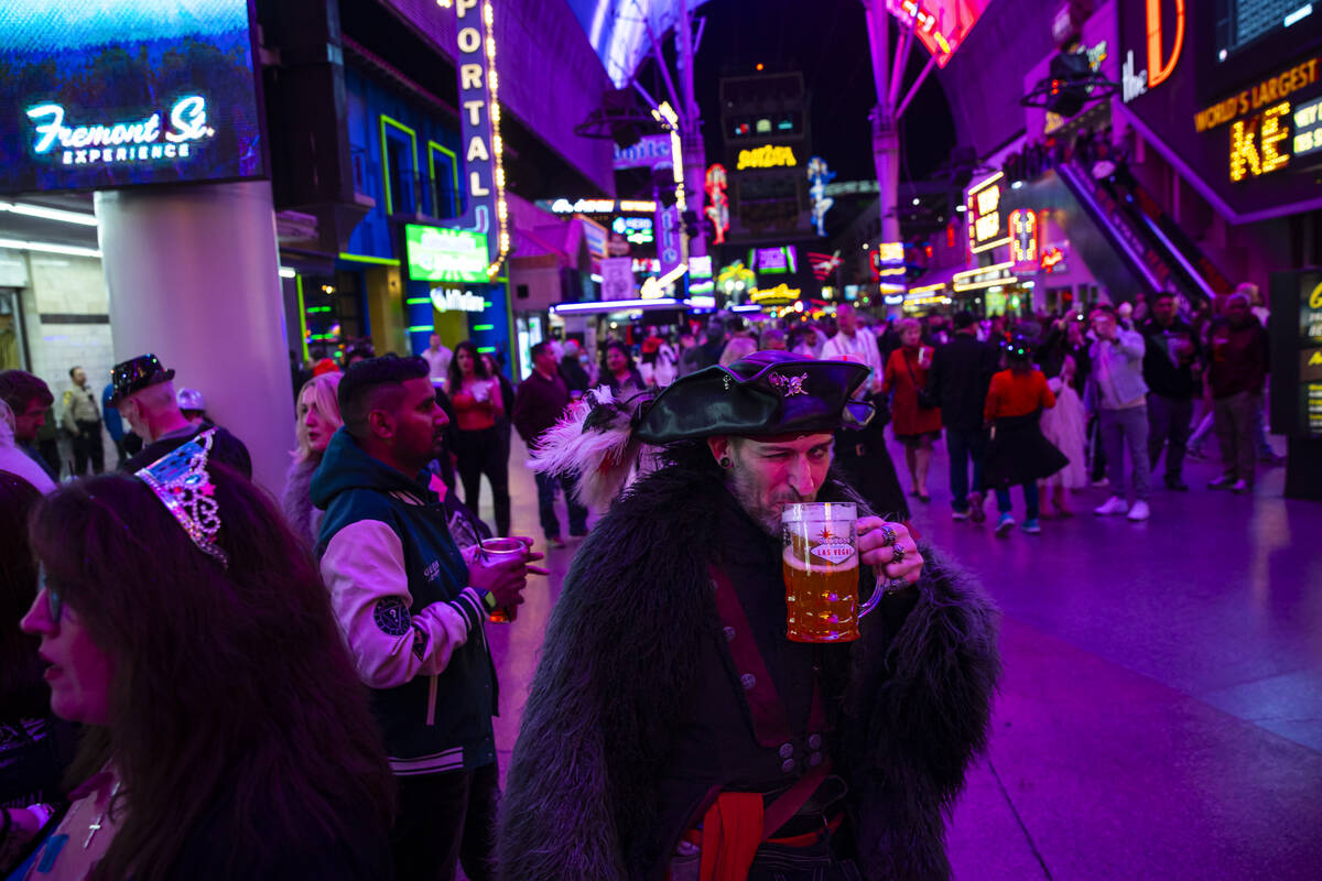 A Michigan man who goes by “Five” and dressed in pirate attire passes by during t ...