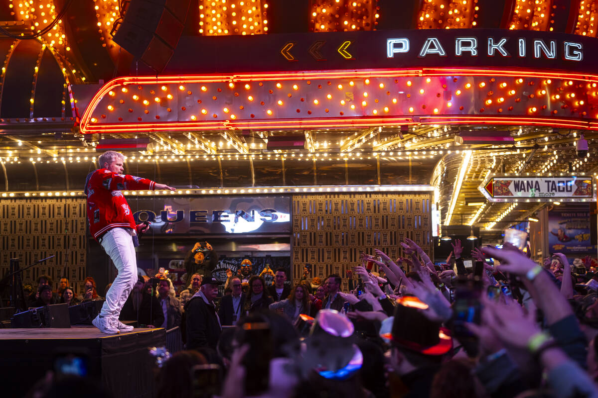 Sean Foreman of 3OH!3 performs at the Fremont Street Experience during the New Year’s Ev ...