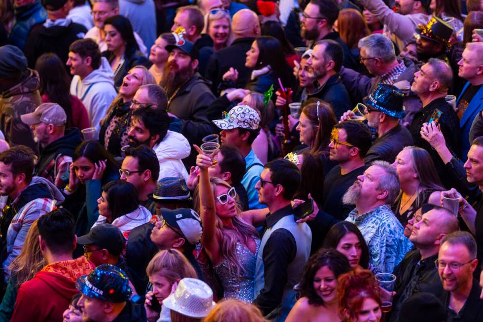 People celebrate the New Year while celebrating at the Fremont Street Experience Wednesday, Jan ...