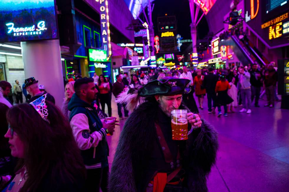 A Michigan man who goes by “Five” and dressed in pirate attire passes by during t ...