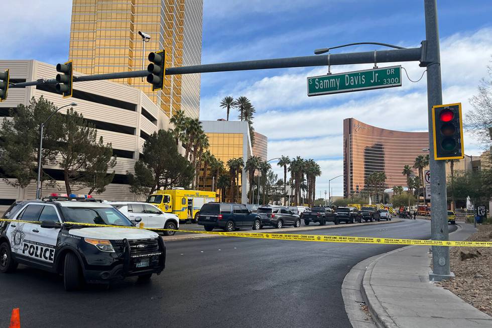 Police enforce road closures at Desert Inn Road and Sammy Davis Jr. Drive after a vehicle fire ...