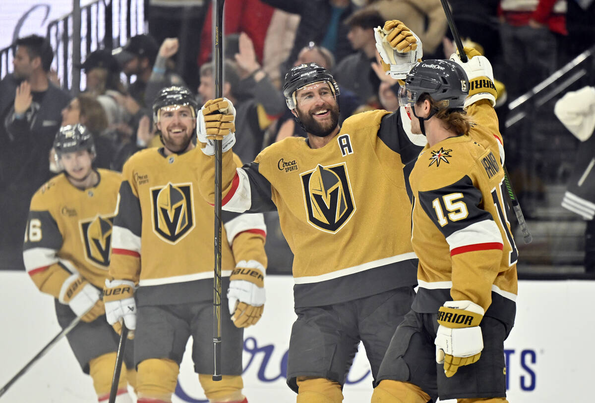 Vegas Golden Knights defenseman Alex Pietrangelo, second right, congratulates Noah Hanifin (15) ...