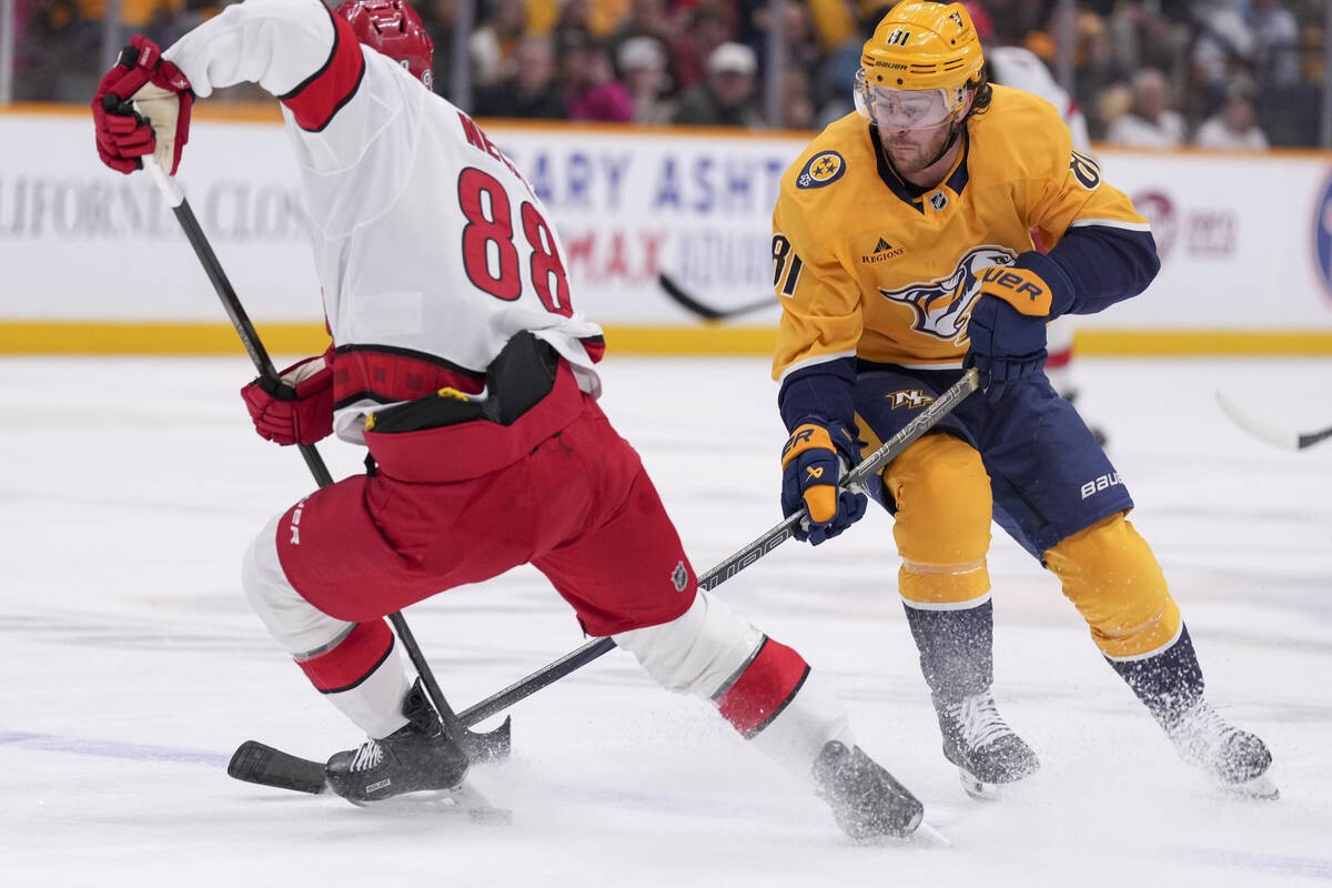 Nashville Predators center Jonathan Marchessault (81) takes the puck from Carolina Hurricanes c ...