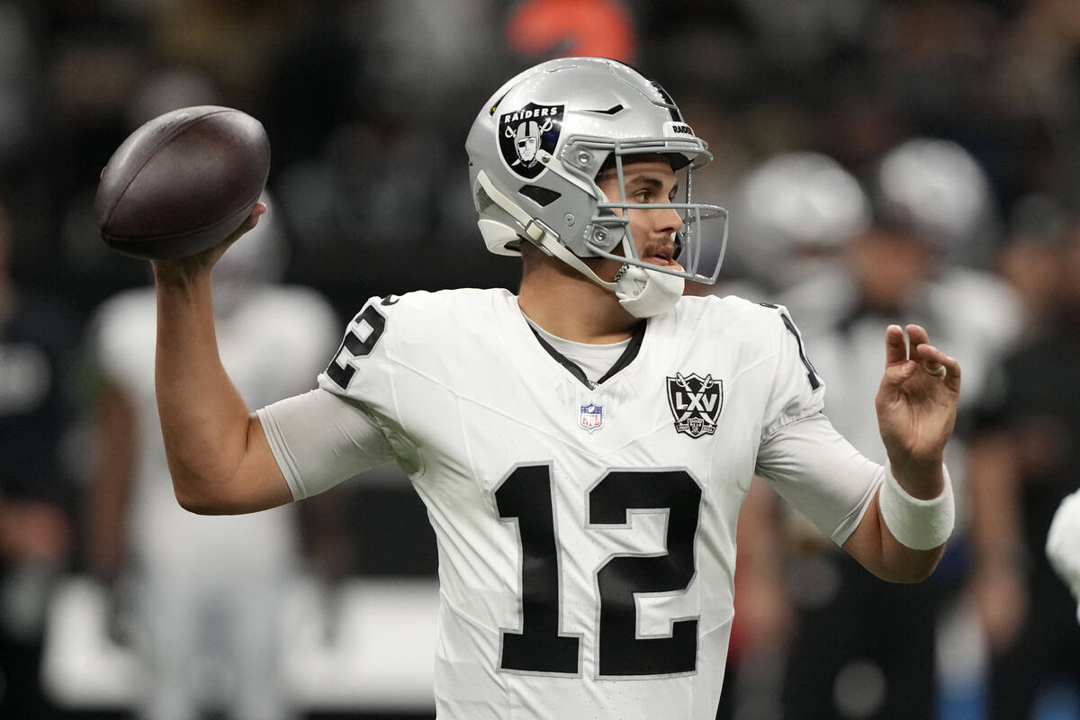 Las Vegas Raiders quarterback Aidan O'Connell throws a pass during the first half of an NFL foo ...