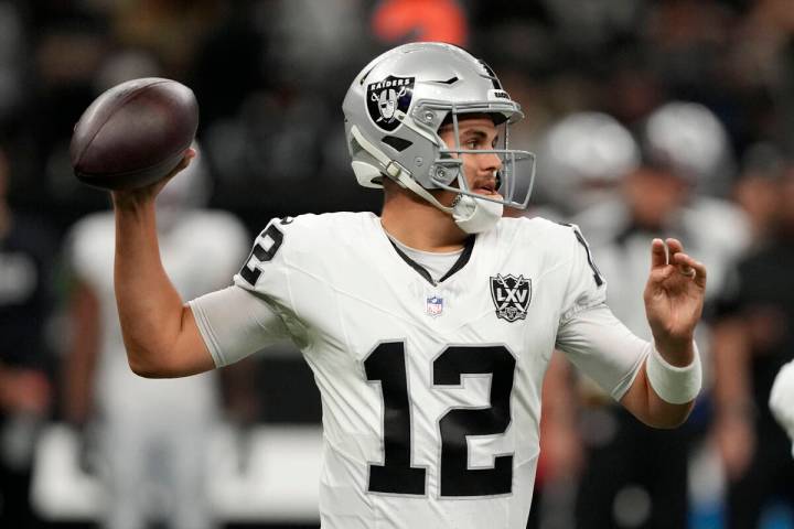 Las Vegas Raiders quarterback Aidan O'Connell throws a pass during the first half of an NFL foo ...