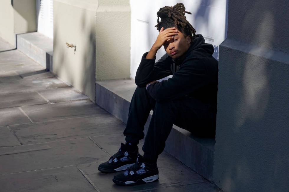 Trevant Hayes, 20, sits in the French Quarter after the death of his friend, Nikyra Dedeaux, 18 ...