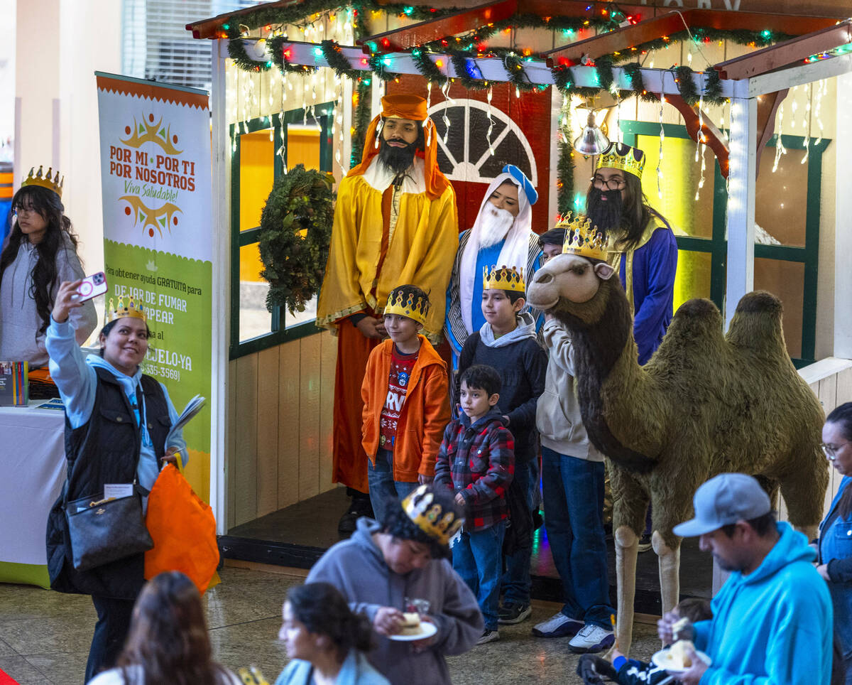 People enjoy a few moments with the Three Wise Men and even a camel as Clark County celebrates ...