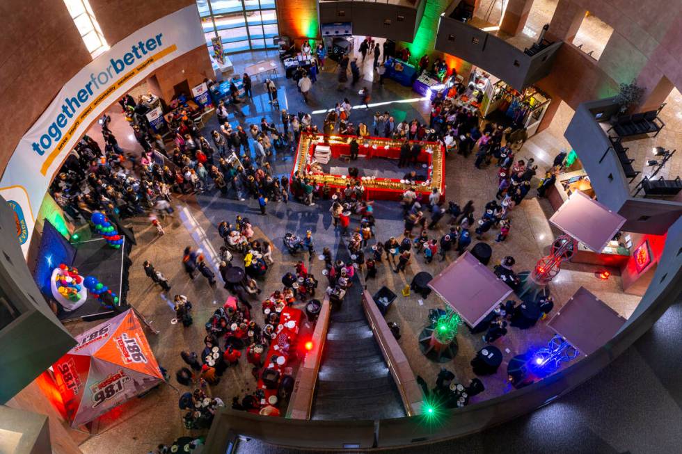 People wait in line to get a slice of the Rosca de Reyes (King’s Cake) and hopefully find a h ...