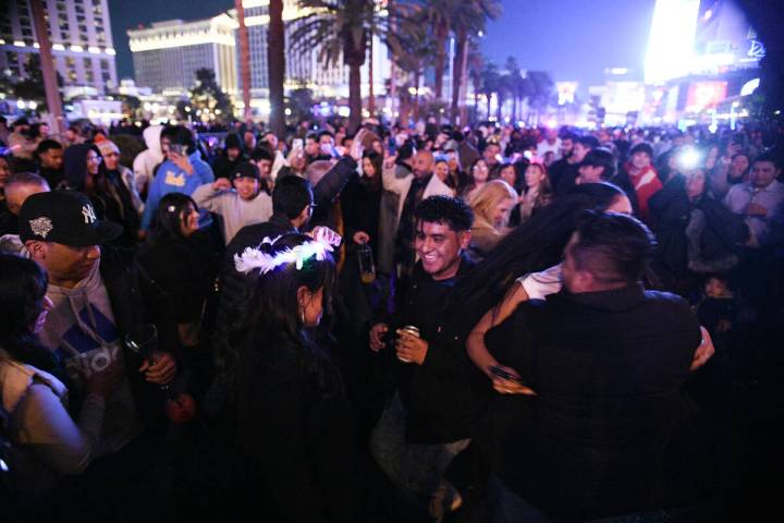 A group of people have an impromptu dance on the Strip Tuesday, December 31, 2024, in Las Vegas ...