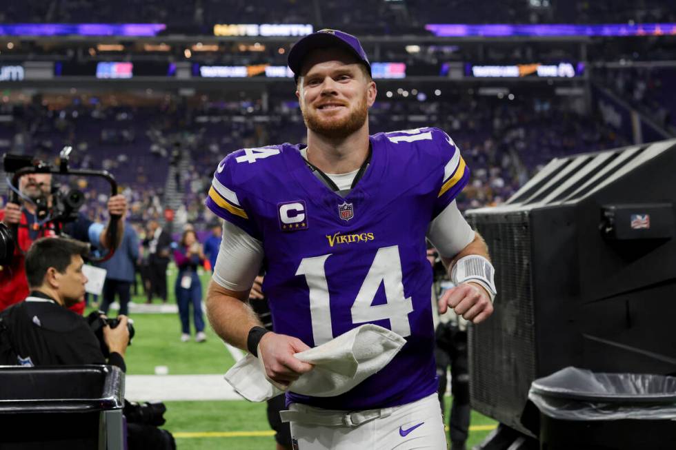 Minnesota Vikings quarterback Sam Darnold (14) smiles while leaving the field after winning 27- ...