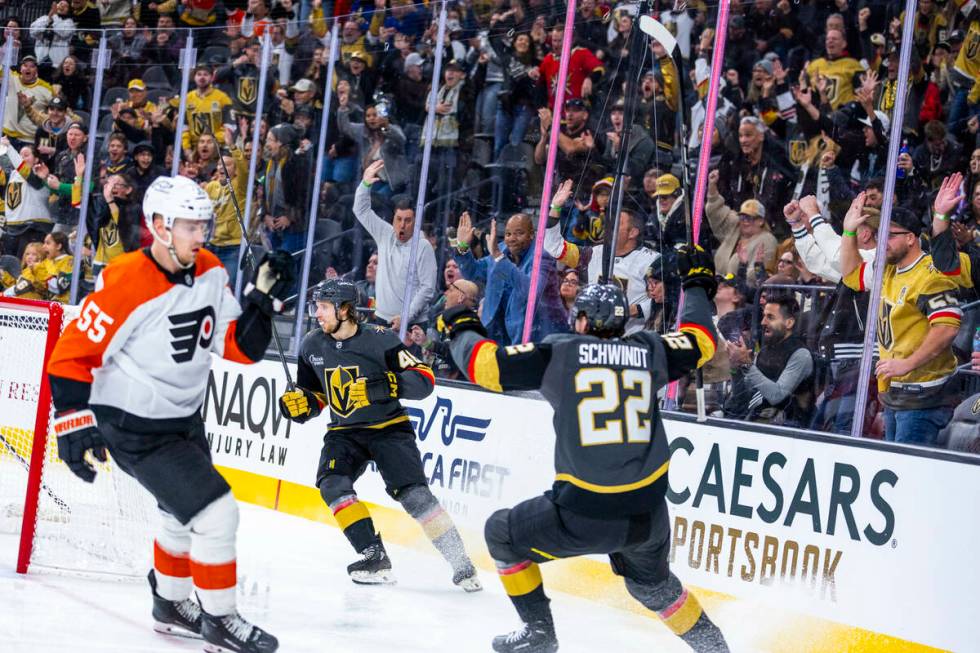 Golden Knights Wing Jonas Rondbjerg (46) and Golden Knights right wing Cole Schwindt (22) celeb ...