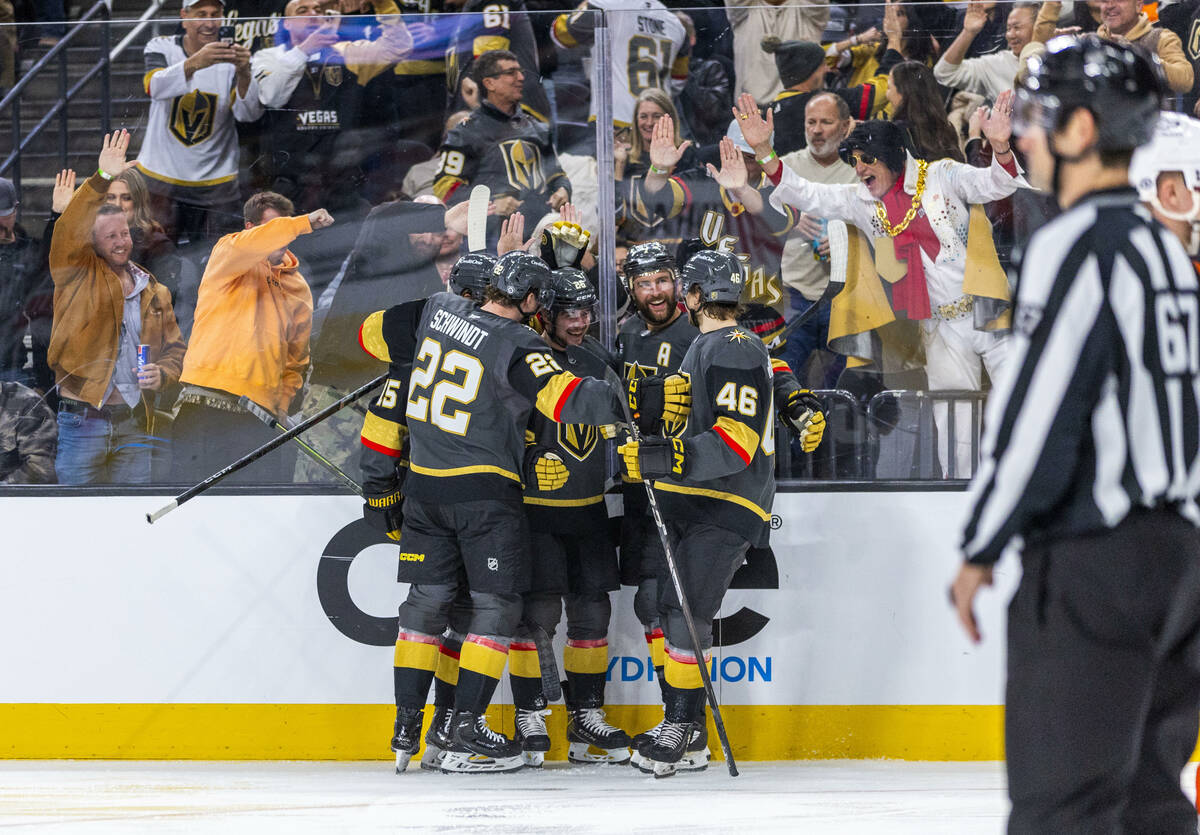 Golden Knights players celebrate another goal against the Philadelphia Flyers goaltender Alekse ...