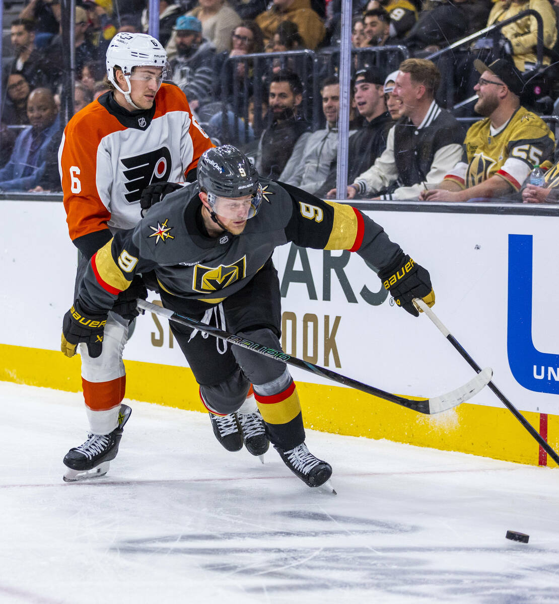 Golden Knights center Jack Eichel (9) battles for the puck against Philadelphia Flyers defensem ...