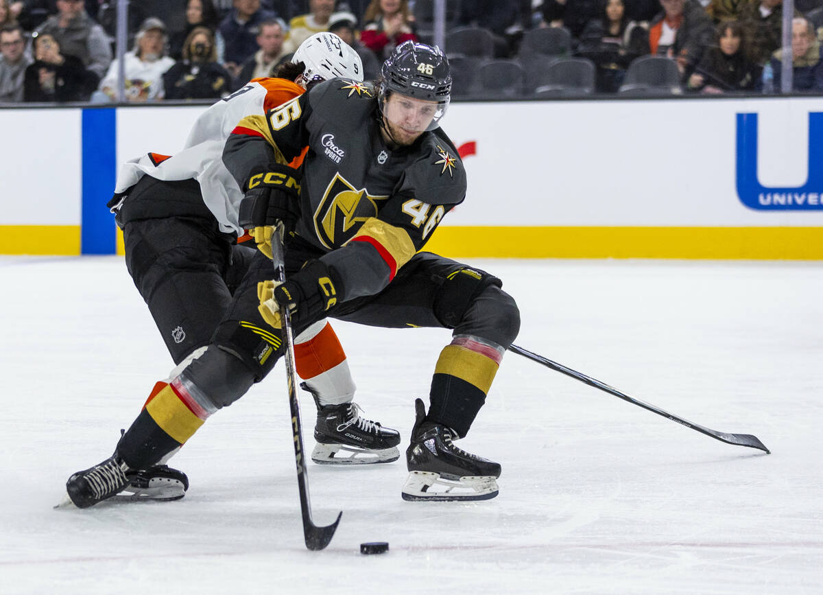 Golden Knights Wing Jonas Rondbjerg (46) looks to shoot past Philadelphia Flyers defenseman Jam ...