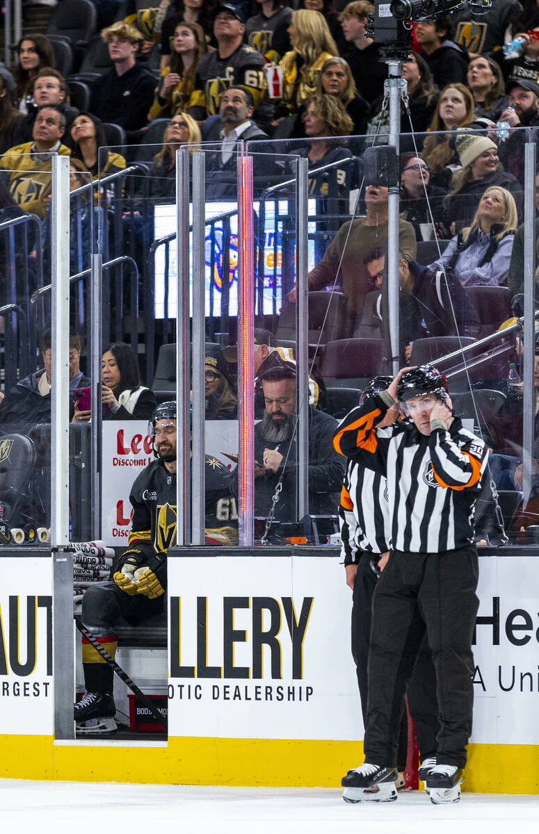 Golden Knights right wing Mark Stone (61) sits in the penalty box as officials get straightened ...