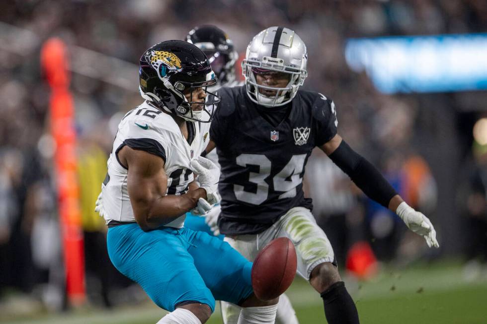 Jacksonville Jaguars wide receiver Devin Duvernay (12) fumbles the football as Raiders safety T ...