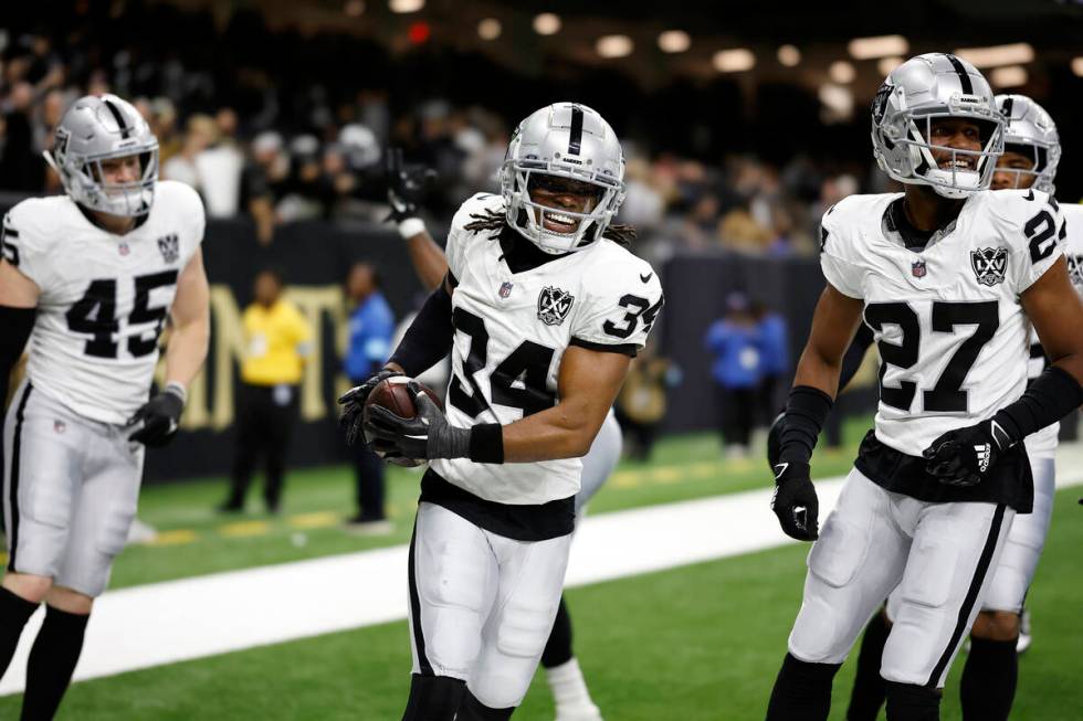 Las Vegas Raiders safety Thomas Harper (34) celebrates after a play during an NFL football game ...