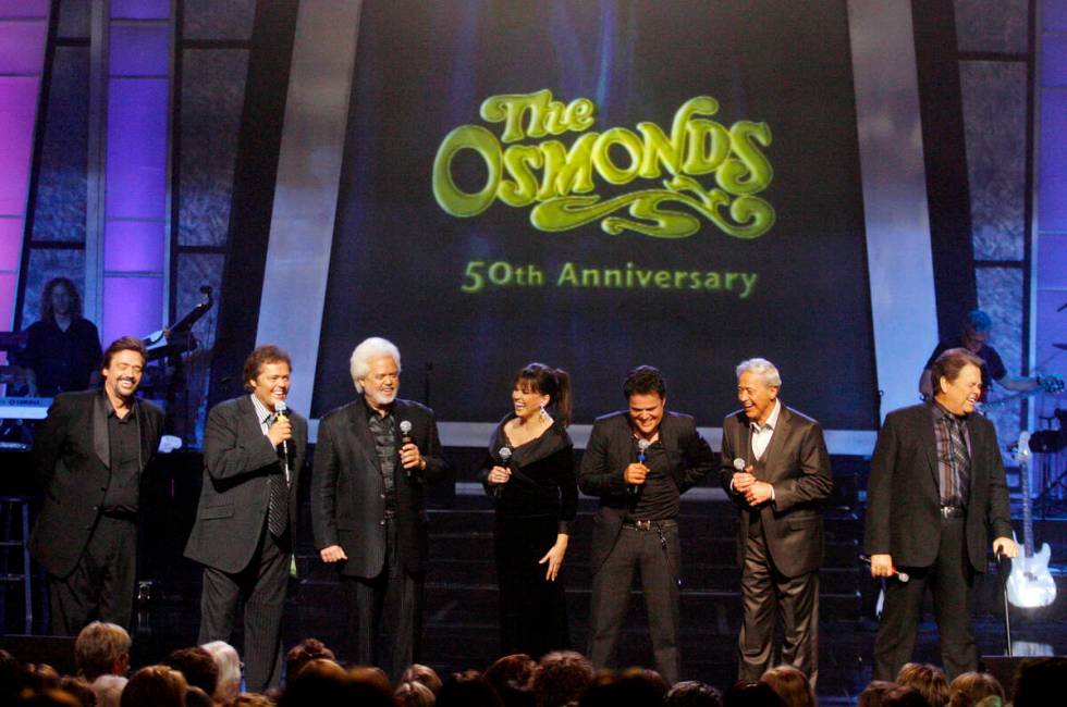 The Osmonds from left, Jay, Jimmy, Merrill, Marie, Donny, Wayne, and Alan perform during a tapi ...