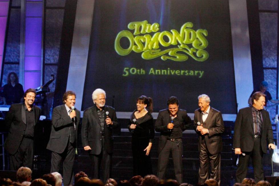 The Osmonds from left, Jay, Jimmy, Merrill, Marie, Donny, Wayne, and Alan perform during a tapi ...