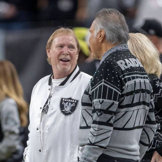 Raiders owner Mark Davis, left, speaks with former Raiders quarterback Jim Plunkett on the side ...