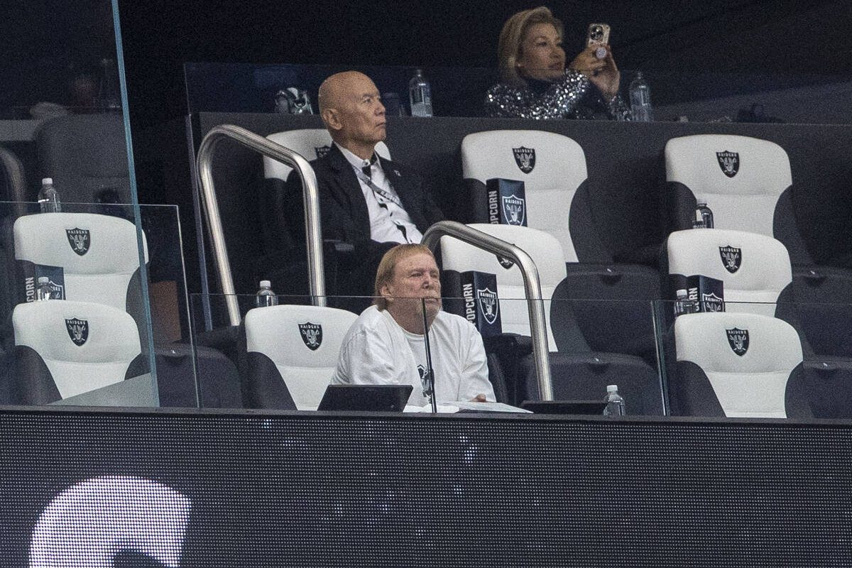 Raiders owner Mark Davis, front, watches the team play the Jacksonville Jaguars from his suite ...