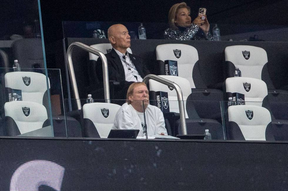 Raiders owner Mark Davis, front, watches the team play the Jacksonville Jaguars from his suite ...