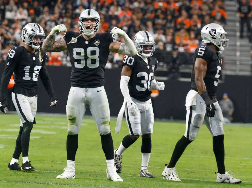 Raiders defensive end Maxx Crosby (98) celebrates a Denver Broncos defensive stop during the fi ...