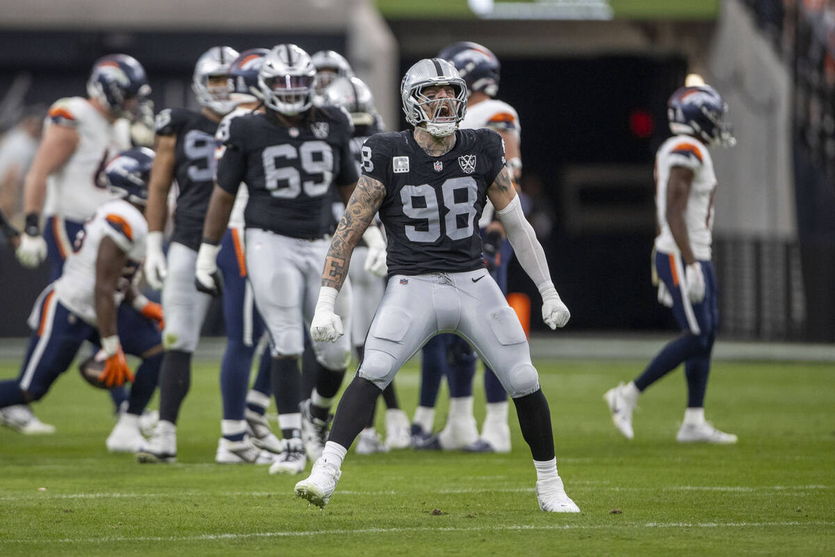 Raiders defensive end Maxx Crosby (98) celebrates a tackle for loss during the first half of an ...