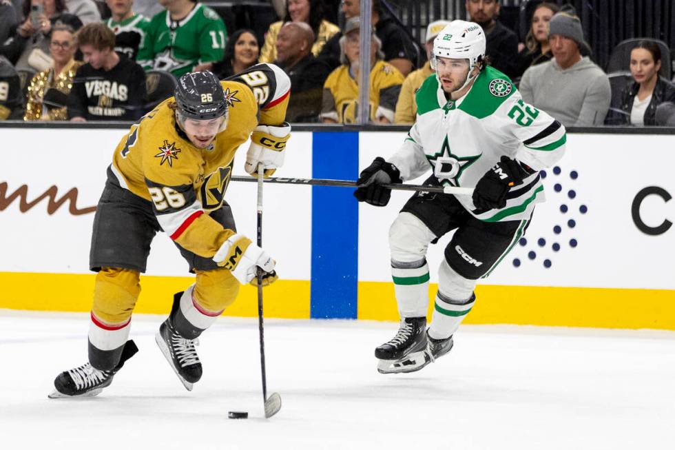 Golden Knights right wing Alexander Holtz (26) maneuvers around Dallas Stars center Mavrik Bour ...