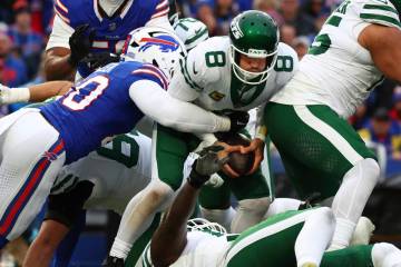 New York Jets quarterback Aaron Rodgers (8) is sacked by Buffalo Bills linebacker Von Miller (4 ...