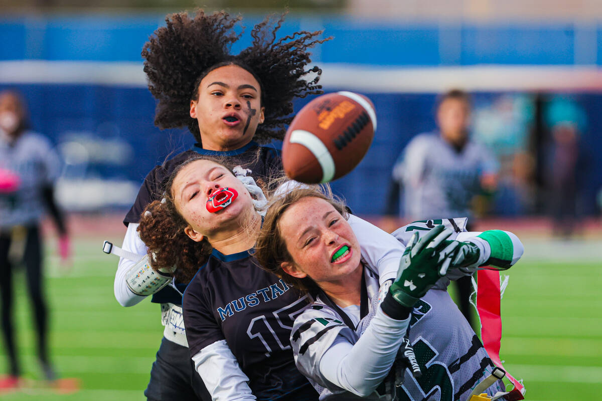 Palo Verde wide receiver Alexis Manzo (15) is held back from a throw meant for her by Shadow Ri ...