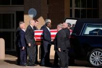 Former and current U.S. Secret Service agents assigned to the Carter detail, move the flag-drap ...