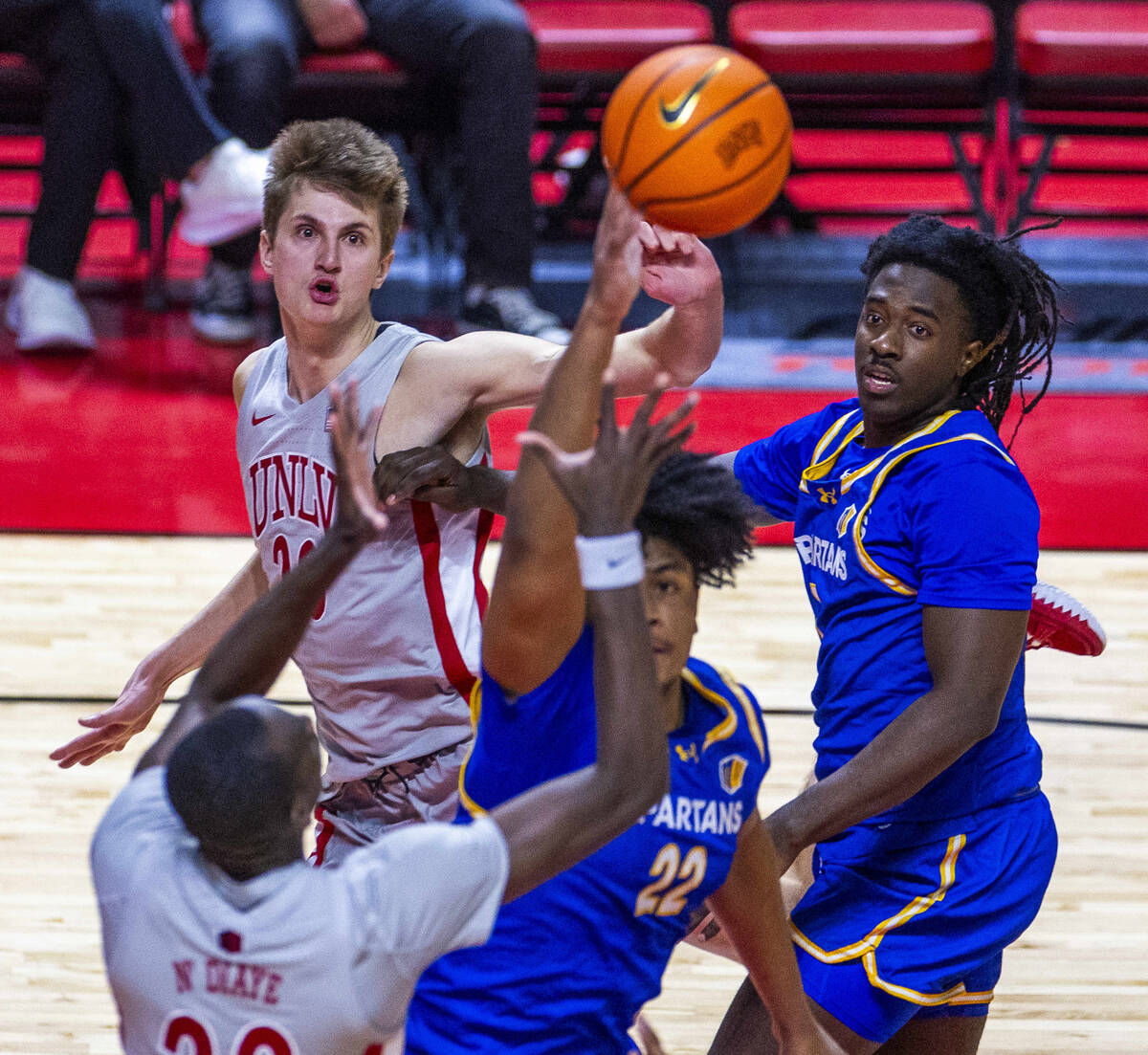 UNLV guard Julian Rishwain (20) looks after his pass over San Jose State Spartans guard Will Mc ...