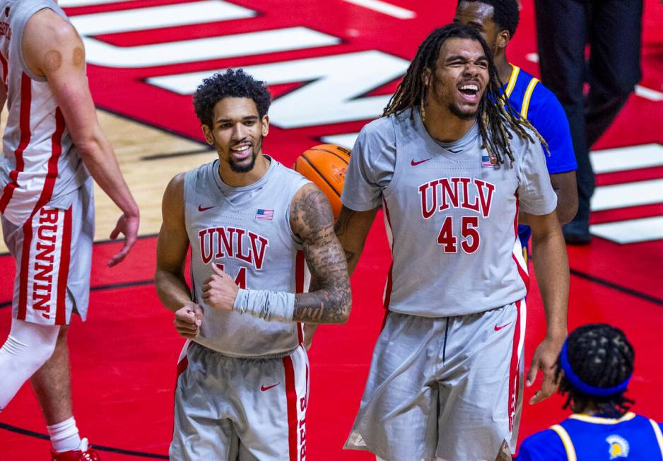 UNLV guard Jailen Bedford (14) and forward Jeremiah "Bear" Cherry (45) are pumped aft ...