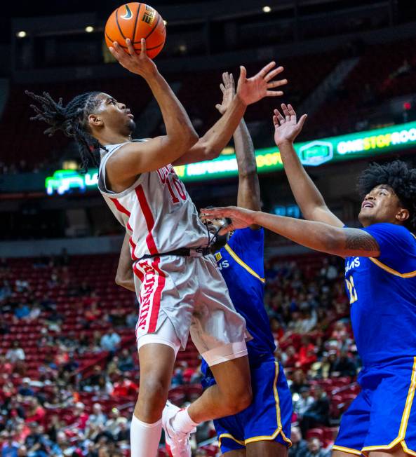 UNLV guard Jaden Henley (10) shoots over San Jose State Spartans guard Josh Uduje (9) and cente ...