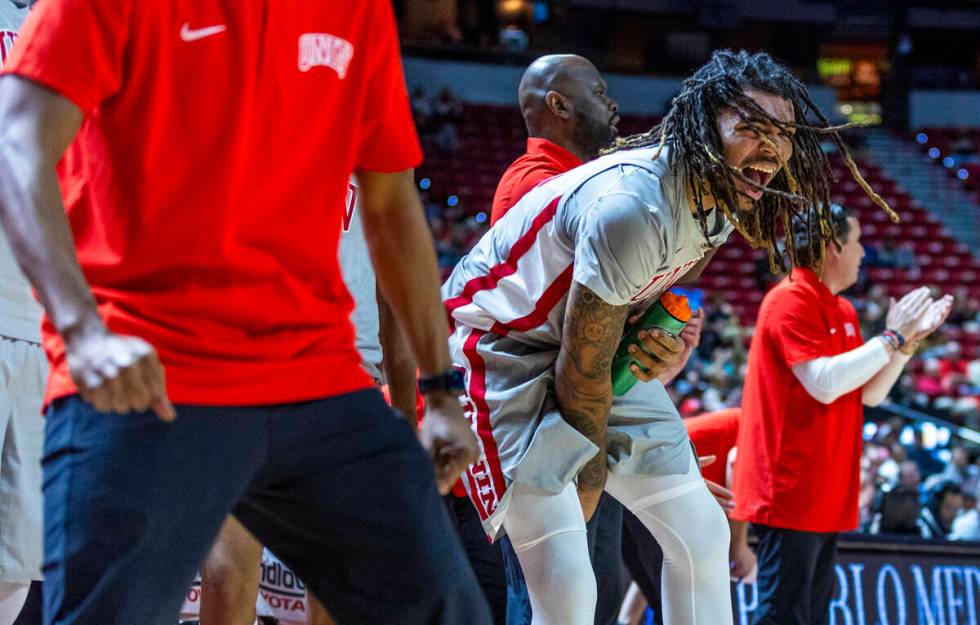 UNLV forward Jeremiah "Bear" Cherry (45) is pumped up on the bench as they solidify t ...