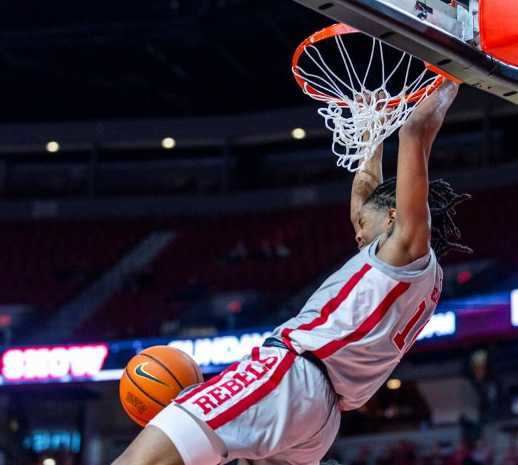 UNLV guard Jaden Henley (10) dunks the ball off of a pass against the San Jose State Spartans d ...