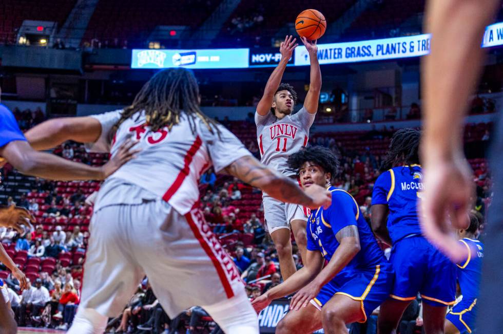 UNLV guard Dedan Thomas Jr. (11) makes critical score late against the San Jose State Spartans ...