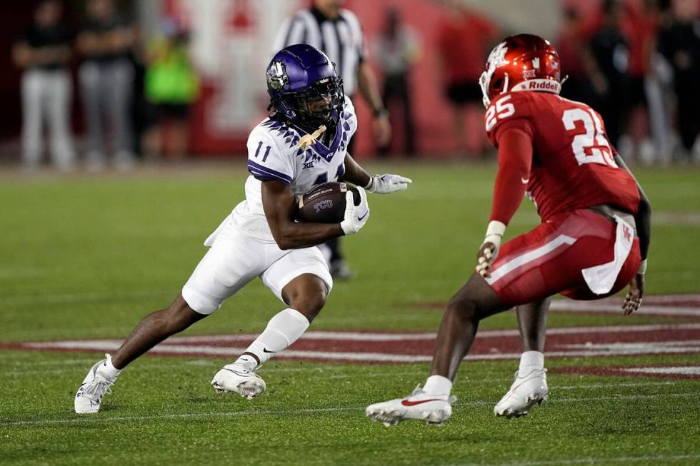 TCU's JoJo Earle (11) runs up field as TCU safety Jamel Johnson (25) defends during the first h ...