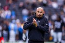 Raiders head coach Antonio Pierce looks to his players during warm ups before facing the Los An ...