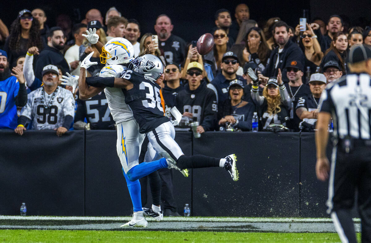 Los Angeles Chargers wide receiver Quentin Johnston (1) is interfered with by Raiders cornerbac ...