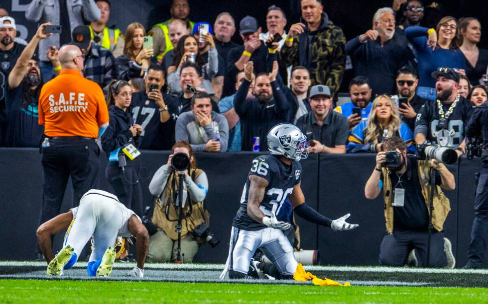 Los Angeles Chargers wide receiver Quentin Johnston (1) is interfered with by Raiders cornerbac ...