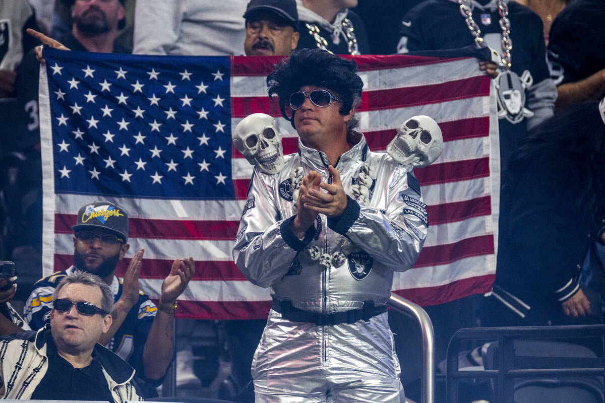 A Raiders Elvis applauds with others while they battle the Los Angeles Chargers during the seco ...