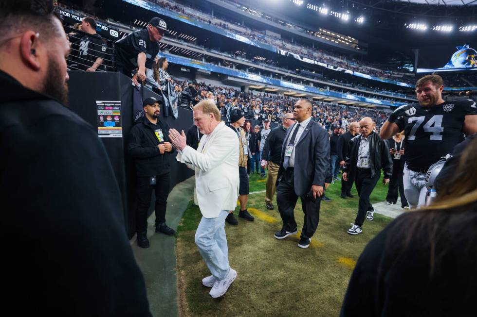 Raiders owner Mark Davis walks off the field during an NFL football game between the Raiders an ...