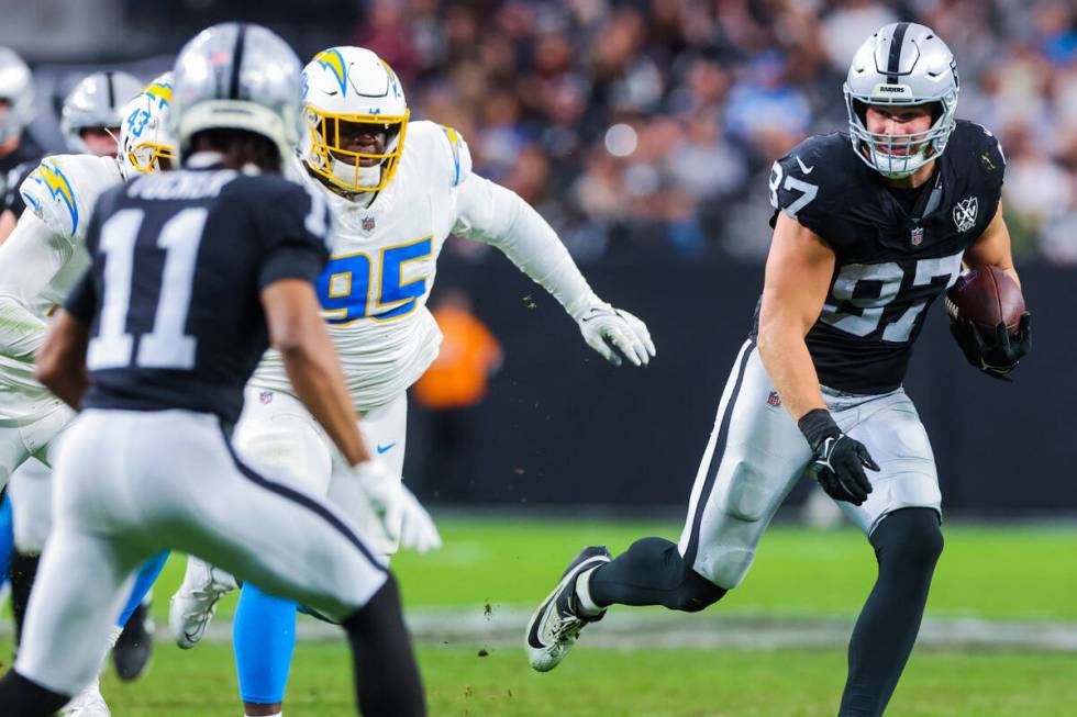 Raiders tight end Michael Mayer (87) runs the ball during an NFL football game between the Raid ...